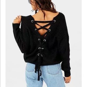 This listing is for a black colored chunky sweater. In original packaging.